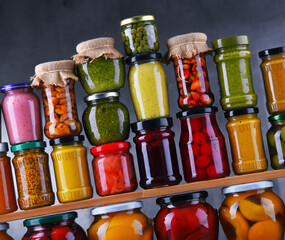 Jars with variety of pickled vegetables and fruits