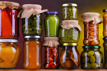 Jars with variety of pickled vegetables and fruits