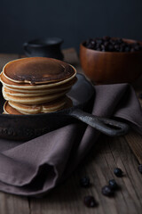 Pancakes in a pan. food photography, dark background