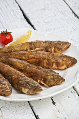 Fried fish goby, Ukrainian cooking. Photo of food on a dark background.