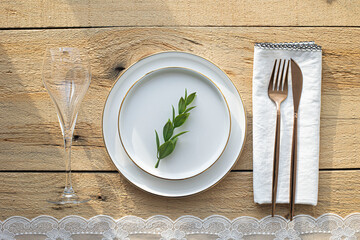 empty plate with cutlery and napkin on wooden background