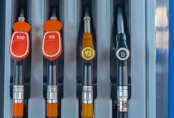 Fuel refueling panel with pistols and marking of common fuel octane numbers.