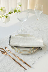 empty plate with cutlery and napkin on white background