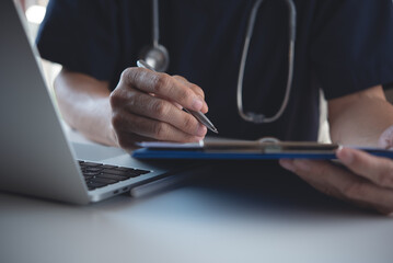 Doctor filling patient's checklist document and prescription, surgeon writing on medical chart...