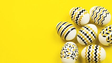 Minimal easter concept. Golden Easter eggs with geometric design on yellow background. Web-banner