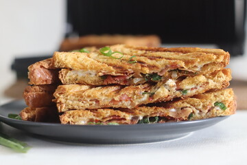 Cream cheese bacon sandwiches. Grilled sandwiches with a spread made of combination of cream cheese, green onions, oregano and chilli flakes