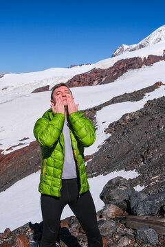 A Man Tourist In The Snow Mountains Soars His Face With Spf Cream