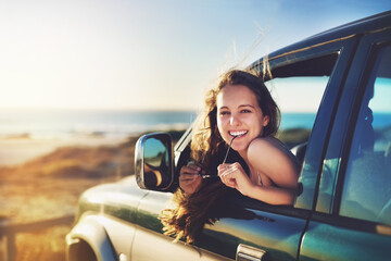 Nothing beats being on the open road. Cropped portrait of an attractive young woman on a roadtrip.