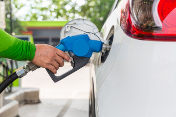 Refill and filling Oil Gas Fuel at station. Gas station refueling. To fill the machine with fuel....