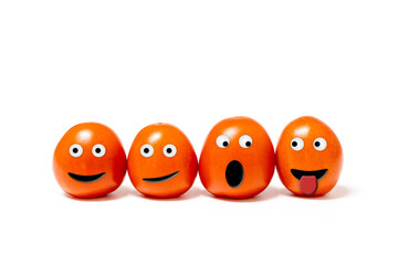four anthropomorphic tomatoes with expressive faces on a white background