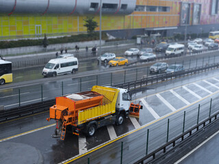 Winter service vehicle clears snow covered roads.