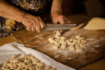 hands kneading gnocchi, Woman working with dough