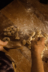 hands kneading gnocchi, Woman working with dough