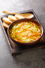 Sopa Juliana traditional Vegetable Soup From Portugal closeup in the plate on the table. Vertical