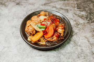 Andongjjimdak, Korean Braised Chicken : To make this dish, chicken is cut into pieces and braised with carrot, potato, and other vegetables, along with a soy sauce-based seasoning. Glass noodles can b