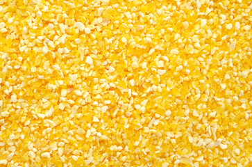 Texture of polenta, yellow cornmeal, top view. Polenta background, yellow cornmeal. Polenta or corn...