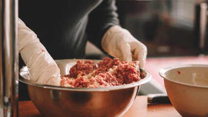 woman preparing meat dough