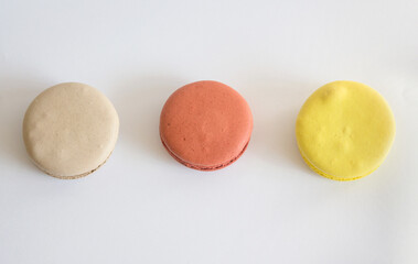 Sweet colorful macarons isolated on white background. 