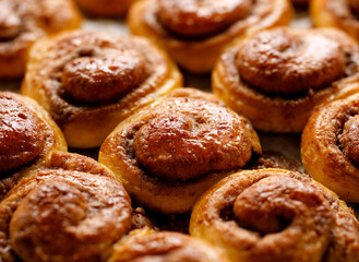 Obraz na płótnie Canvas Traditional sweet cinnamon buns kanelbullar, close up view