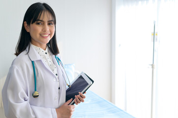 Portrait of young female doctor with stethoscope working at hospital, medical and health care concept