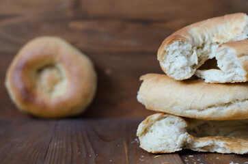 uzbek flatbread white bread is broken into pieces crumbs on a brown background illustration