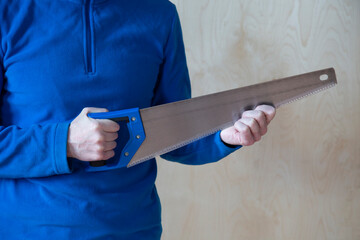 Manual saw for sawing wood.A tool for working on wood.