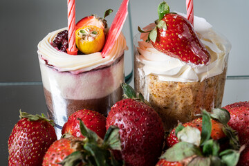 Fruit cake concept with strawberries in the foreground. It is prepared by skilled and professional chefs for luxury hotels.