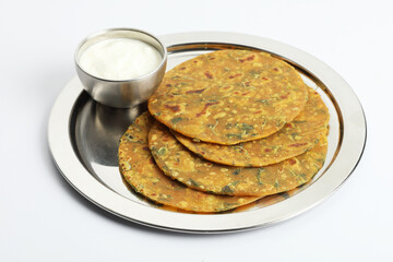 Indian flat bread,Methi Paratha,an Indian flatbread stuffed with fenugreek leaves and spices served with yogurt in breakfast or brunch 