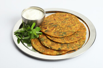 Indian flat bread,Methi Paratha,an Indian flatbread stuffed with fenugreek leaves and spices served with yogurt in breakfast or brunch 