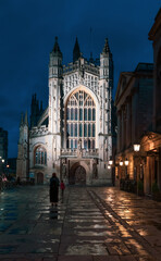 City of Bath, UK. Night sightseeing of Bath downtown with Abbey Church of Saint Peter and Saint Paul next to restored in Victorian times ancient Roman Baths.