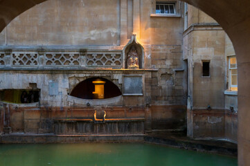 Fototapeta na wymiar City of Bath, UK. Evening sightseeing of restored in Victorian times ancient Roman Baths.