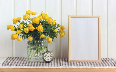 summer rustic composition with a bouquet and an empty frame