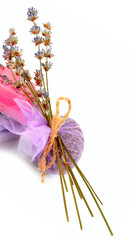 Handmade soap and sachet of lavender flowers isolated on white . Free space for text. Vertical photo.