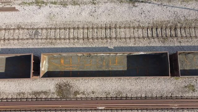 aerial view of empty freight wagons, these wagons are used to transport large quantities of wheat, corn, coal and other materials needed by industry.
