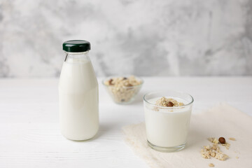 The process of preparing a dietary dessert from homemade kefir, muesli. The concept of healthy eating.