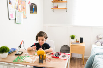 Elementary boy working on science project