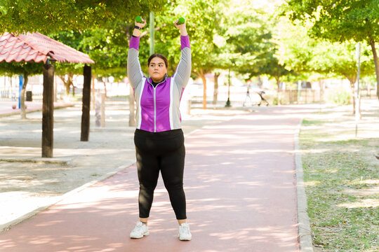 Obese Curvy Woman Lifting Weights