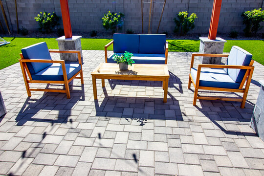 Rear Pavers Patio With Couch, Table And Two Chairs