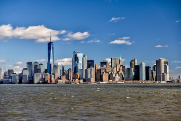 Views of Battery Park and the financial district from the water and Ellis Island in New York City