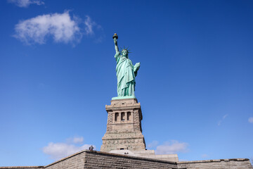 The Statue of Liberty in New York against a blue sky