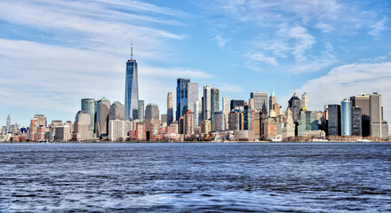 Views of Battery Park and the financial district from the water and Ellis Island in New York City