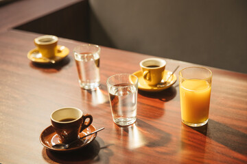 Coffee and Orange juice on the table in the bar