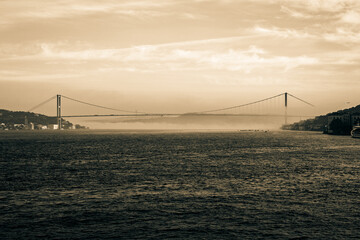 Bosphorus or 15th july martyrs' bridge at foggy weather in the morning