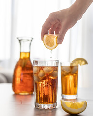 Iced tea with lemon, refreshing lemonade in summer