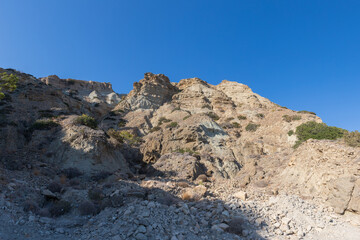 Summer landscape of Crete island in Greece in Europe. Coast in the Larapetra region. In the background is a sunny sky with clouds.