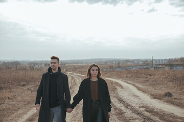 Naklejka premium Young loving couple with coffee on ukrainian nature background