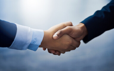 Making big deals happen. Closeup shot of two unrecognizable businesspeople shaking hands in an office.