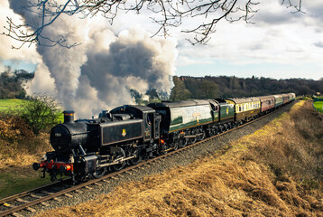 two British steam locomotives double heading a passinger train