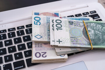 pln polish money on white keyboard laptop