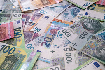 Obraz na płótnie Canvas Stack of polish zloty and euro money as finance background